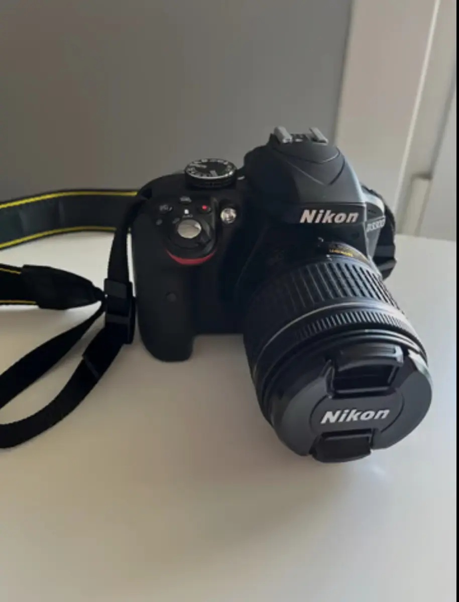 Nikkon d3300 with 18-55 mm lens , charger and case